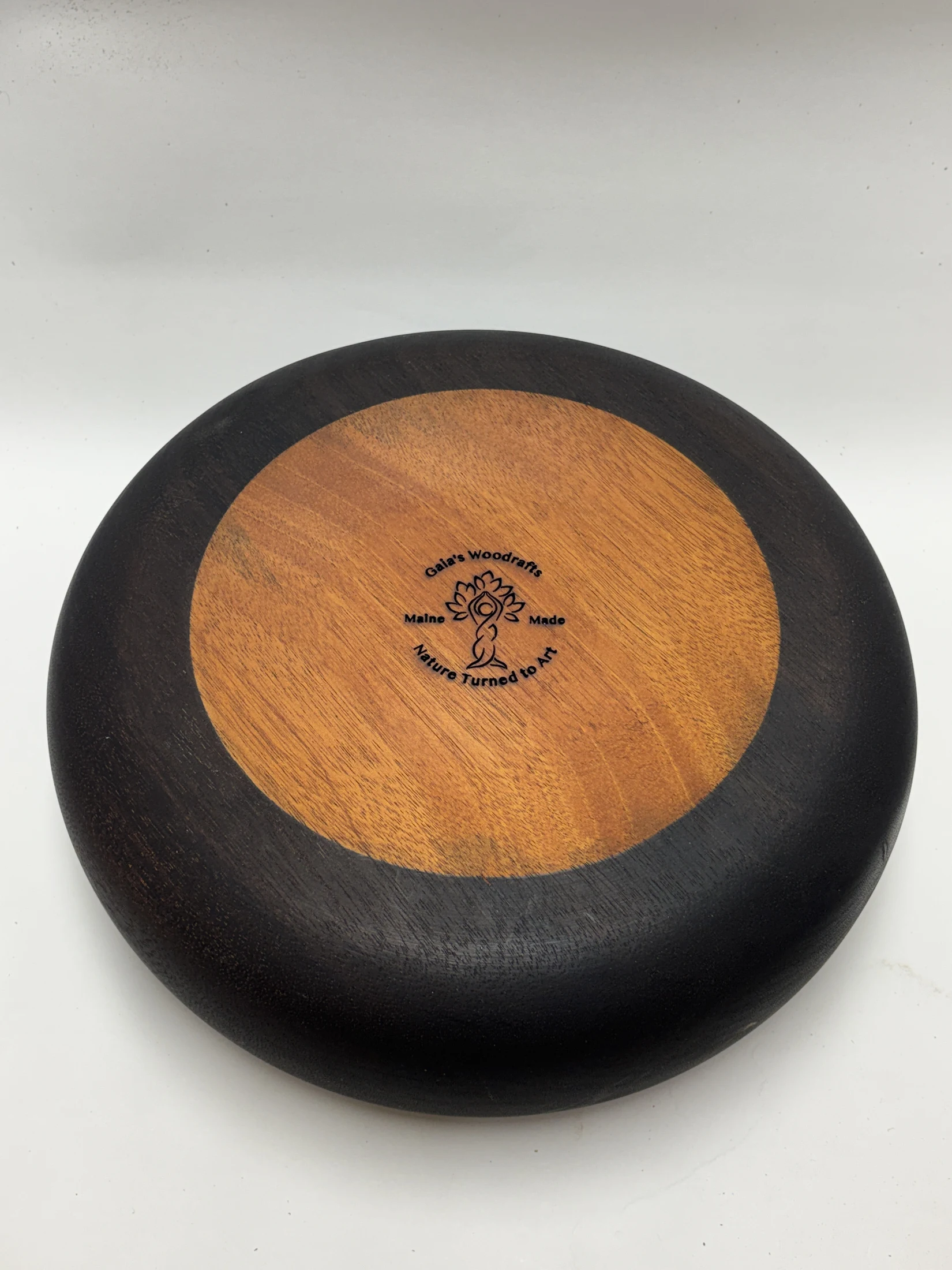 Underside of the Ebonized Sapele Bowl, showing the maker’s stamp and natural sapele base